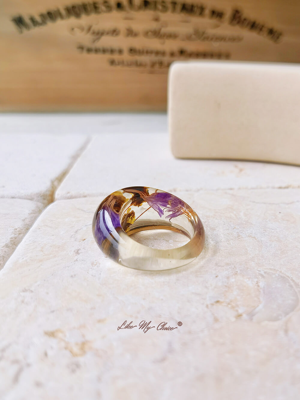 Dried flower resin ring with purple flowers