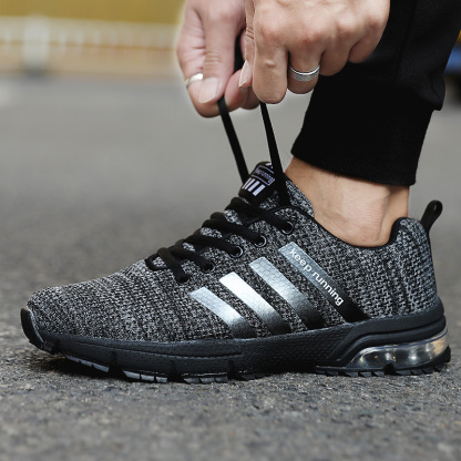 Breathable fly knit casual sports air cushion shoes
