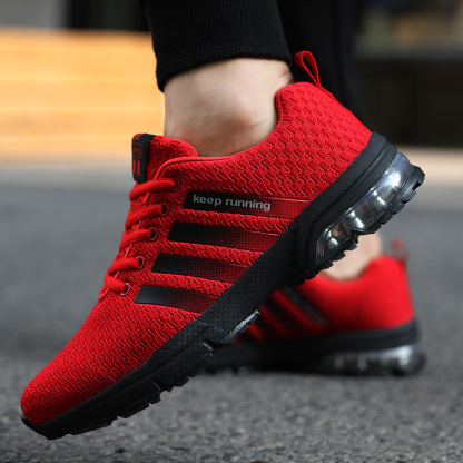 Breathable fly knit casual sports air cushion shoes