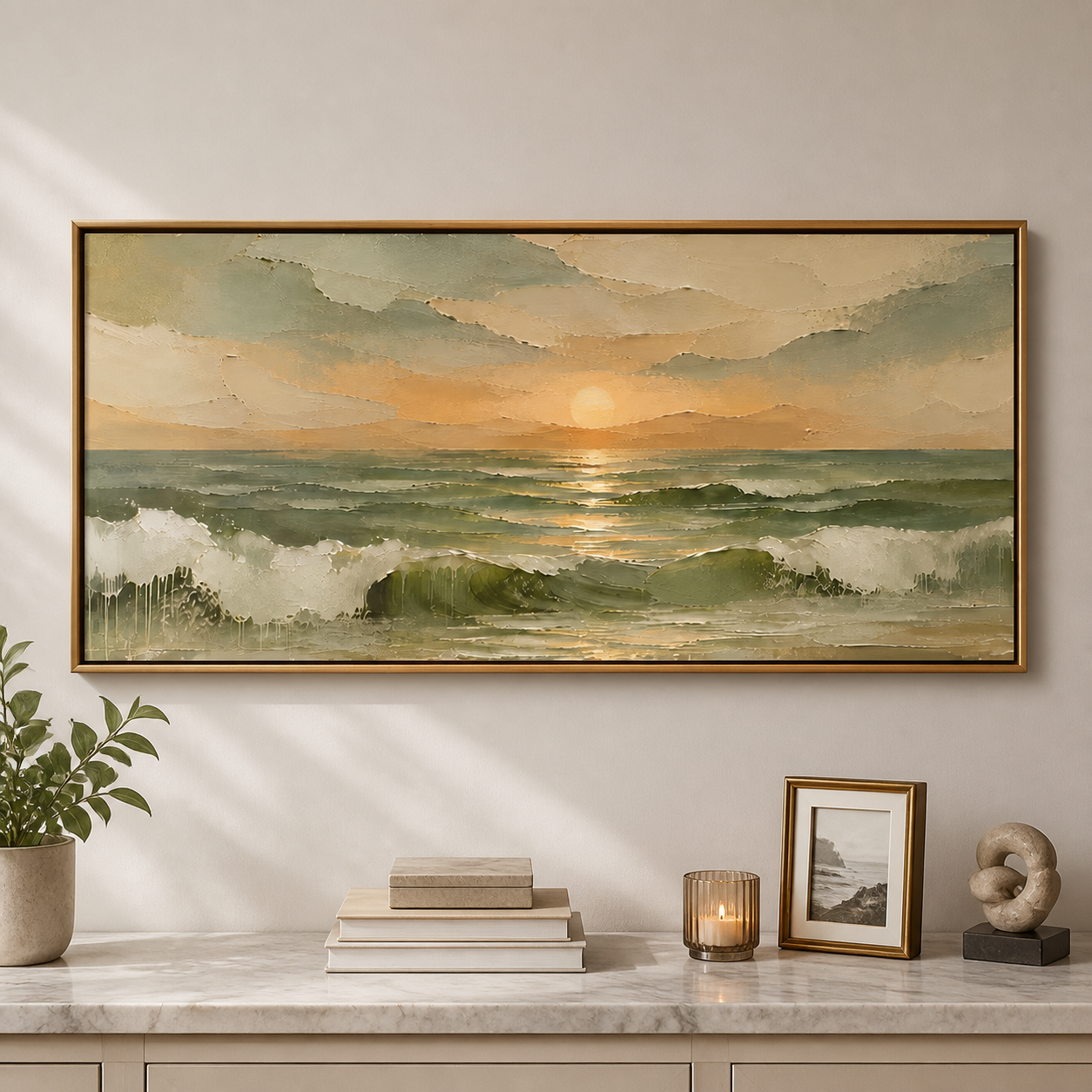 Golden sun above sage-green ocean waves with white foam and warm cream clouds, shown in a room setting