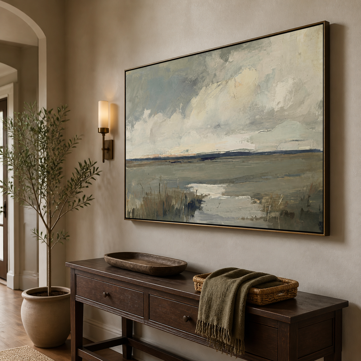 Gray-blue marsh water and reeds beneath broad cream clouds and a distant dark horizon, shown in a room setting