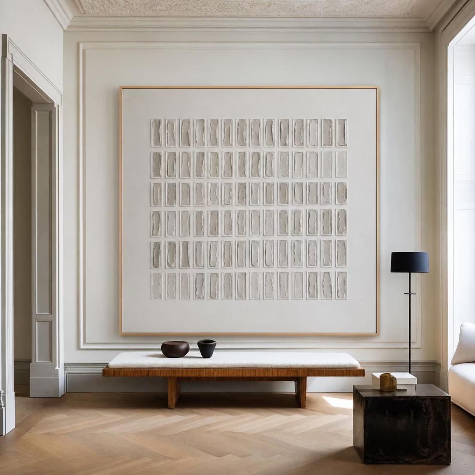 Rows of small gray and ivory rectangles arranged in a square grid, shown in a room setting