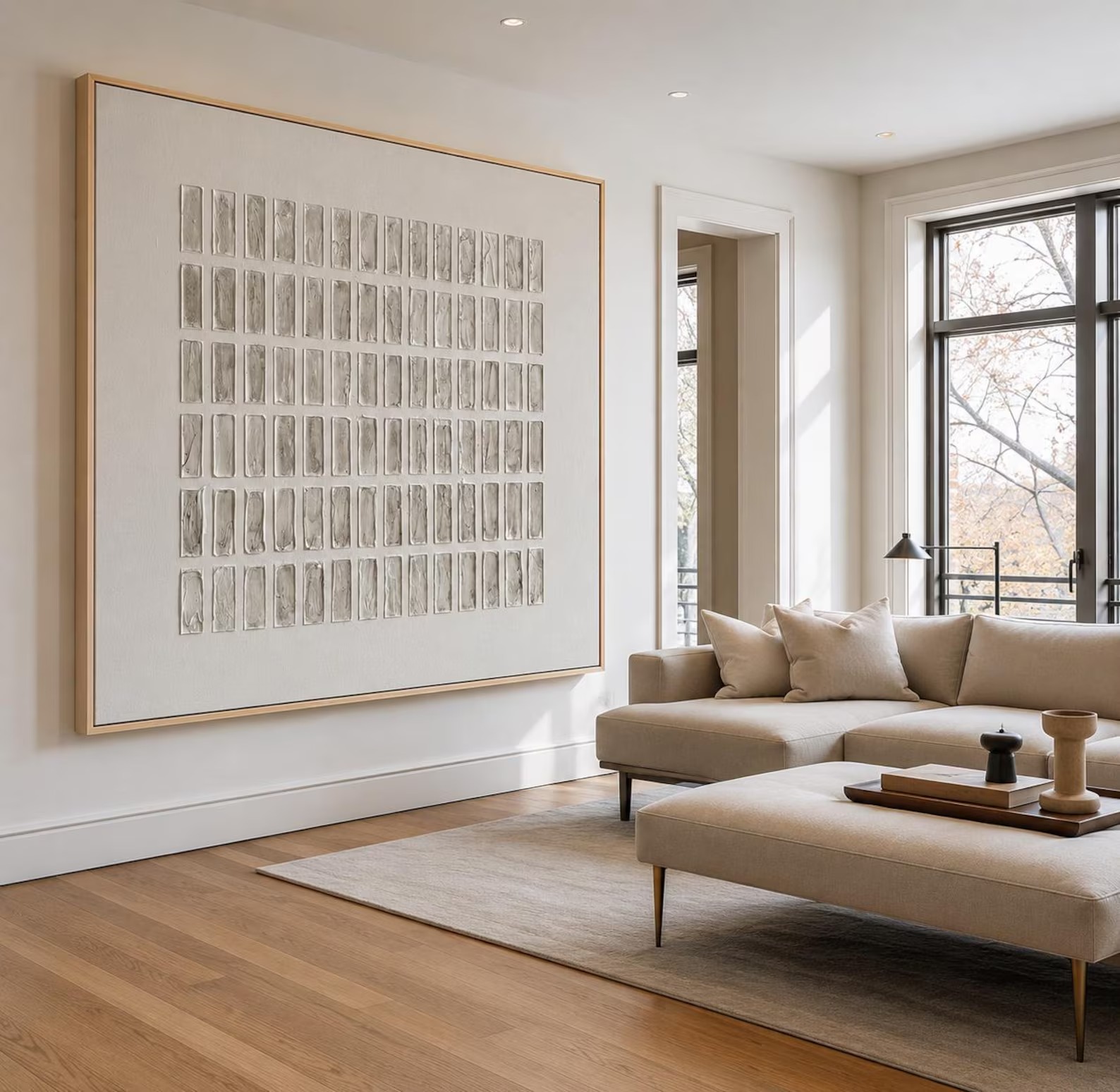Rows of small gray and ivory rectangles arranged in a square grid, shown in a room setting