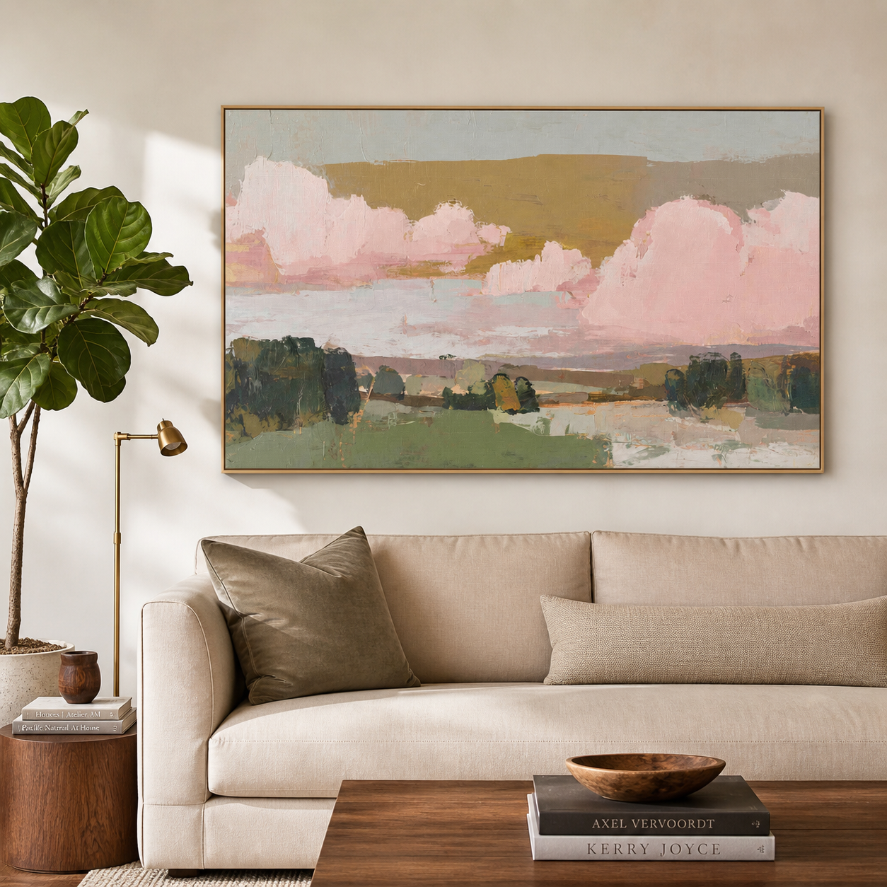 Large pink clouds above green fields and dark trees under a muted ochre sky, shown in a room setting
