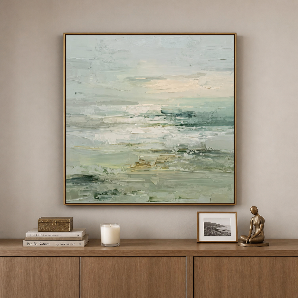 Square abstract landscape with layered sage green, cream, gray, and dark green brushstrokes, shown in a room setting
