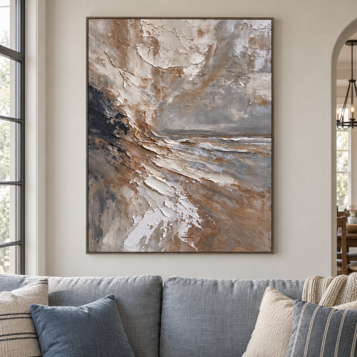 Sweeping ivory and warm brown layers extending from dark slate toward a gray horizon, shown in a room setting