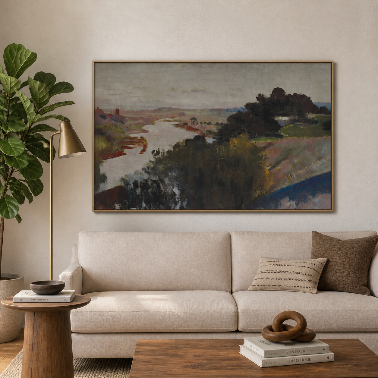 A winding pale river through muted rust and olive countryside with dark trees and a gray sky, shown in a room setting