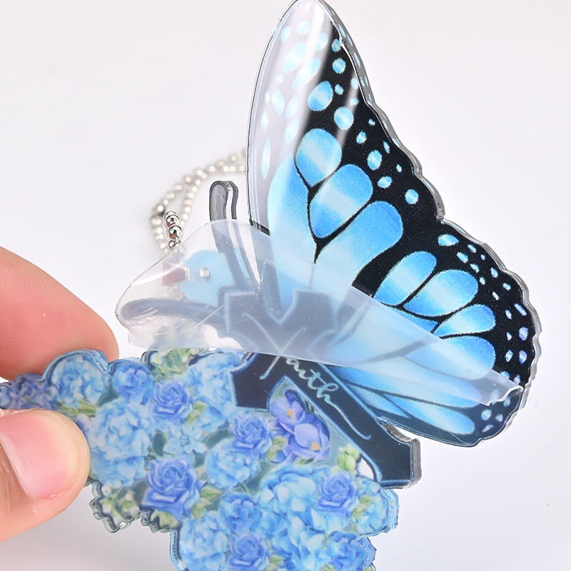 Add a Touch of Elegance to Your Home or Car with this Acrylic Blue Butterfly Flower Jesus Cross Pendant!