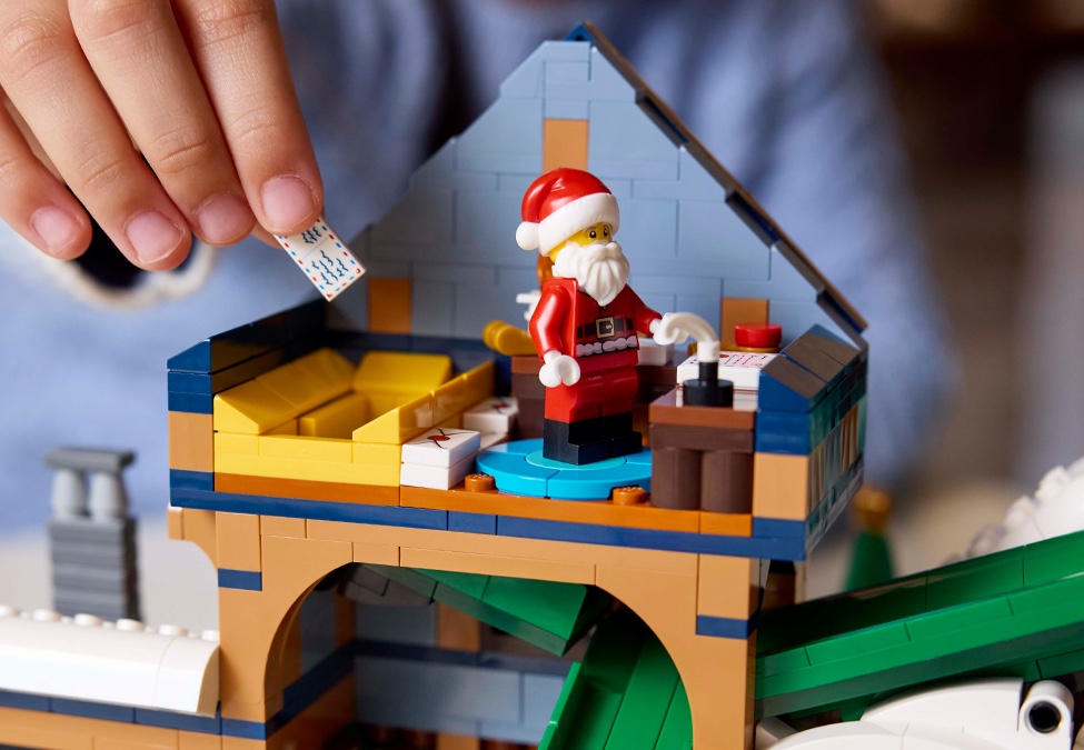 Santa LEGO minifigure beside sorting chute on set