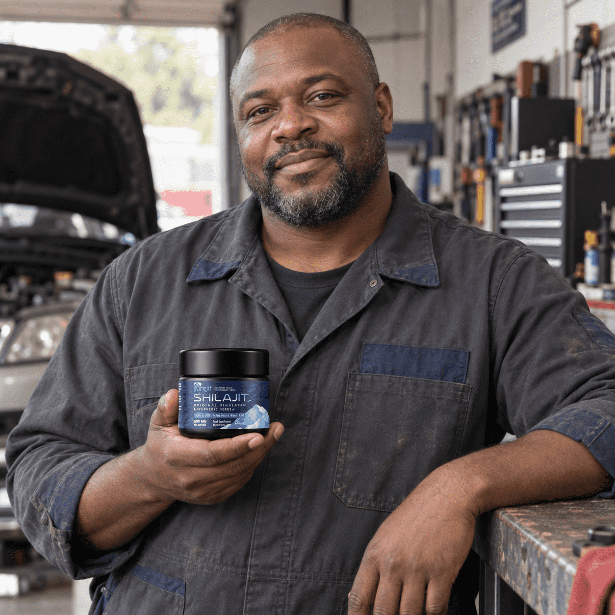 Illustrative auto mechanic with the Purejit product.