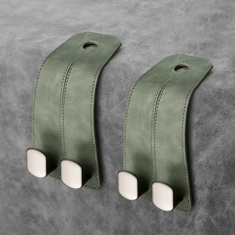 Two pack of alpine green car headrest hangers enhancing a Porsche cabin aesthetic
