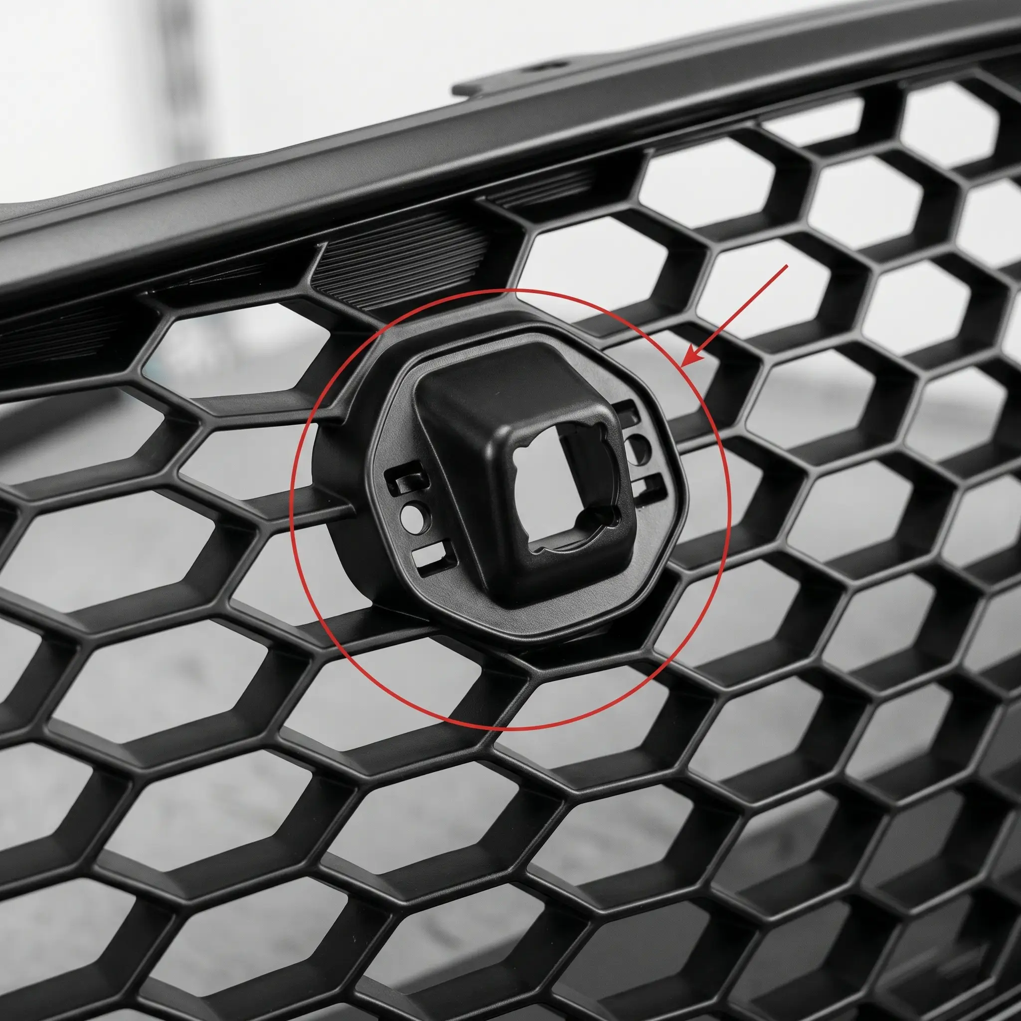 Audi Q5 honeycomb grille with front camera bracket detail
