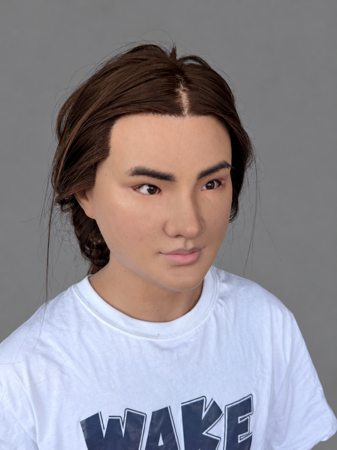Realistic female silicone mask with yellow skin and long hair