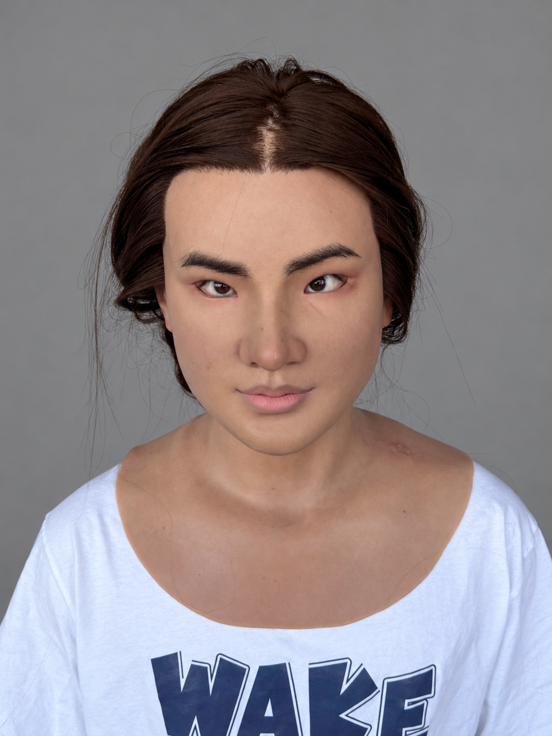 Realistic female silicone mask with yellow skin and long hair