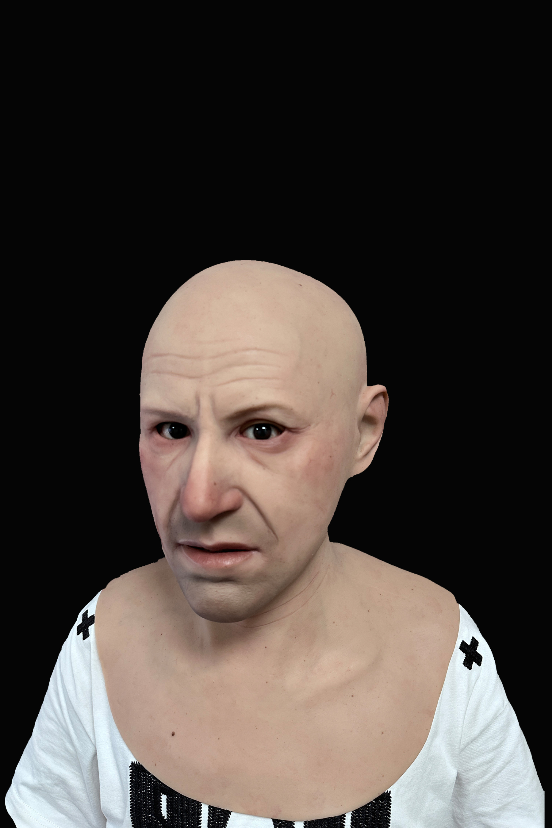 Bald elderly man silicone mask with realistic wrinkles and pale skin tone