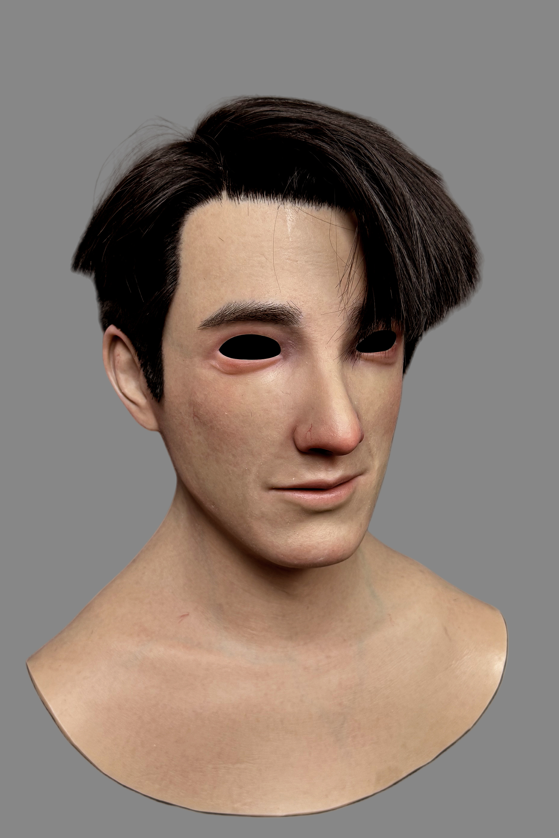 Right three-quarter view of hyper-realistic K-pop style Asian male silicone mask with natural skin tone and detailed facial features.