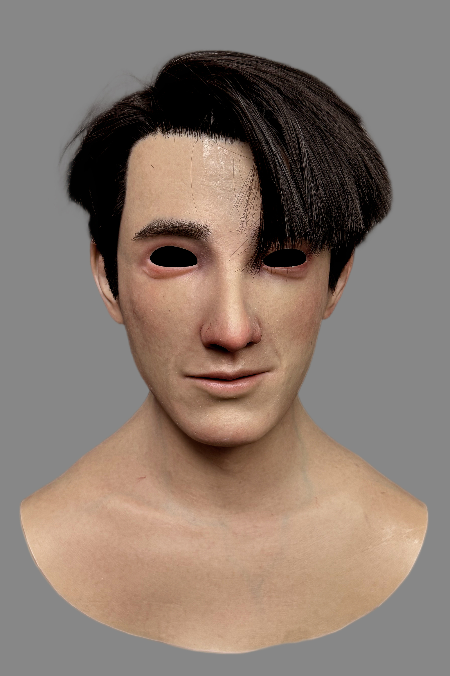 Side view of ultra-realistic East Asian male silicone disguise mask featuring hand-punched real hair and detailed ear structure.