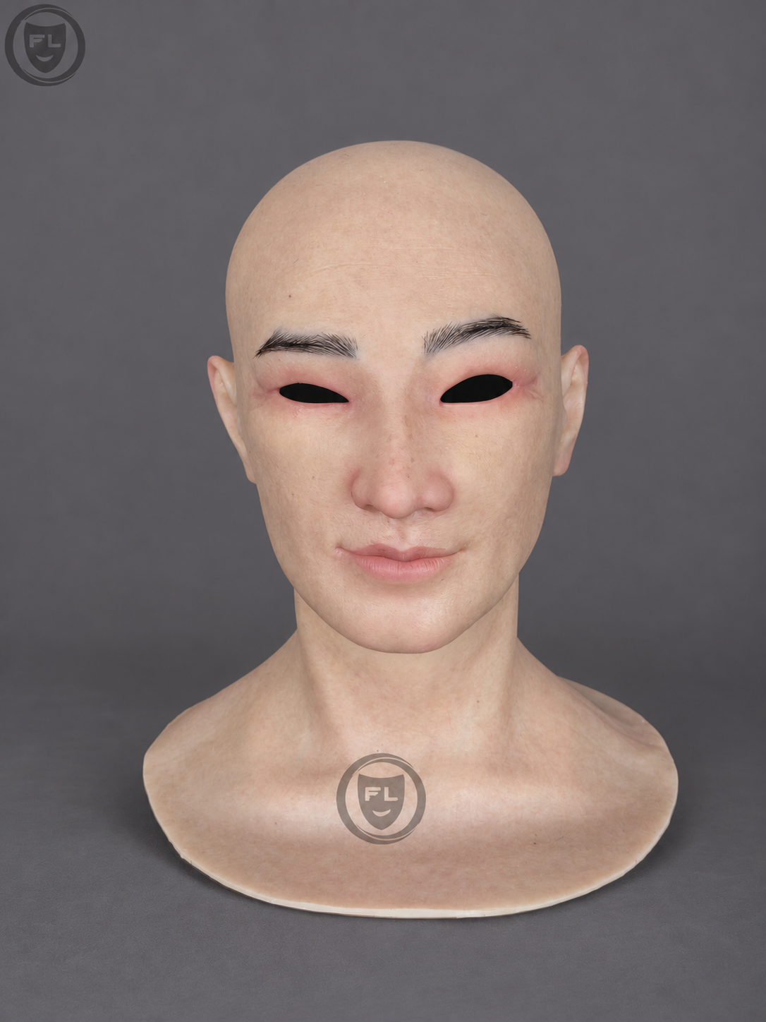 Realistic middle-aged silicone mask with a bald Asian face
