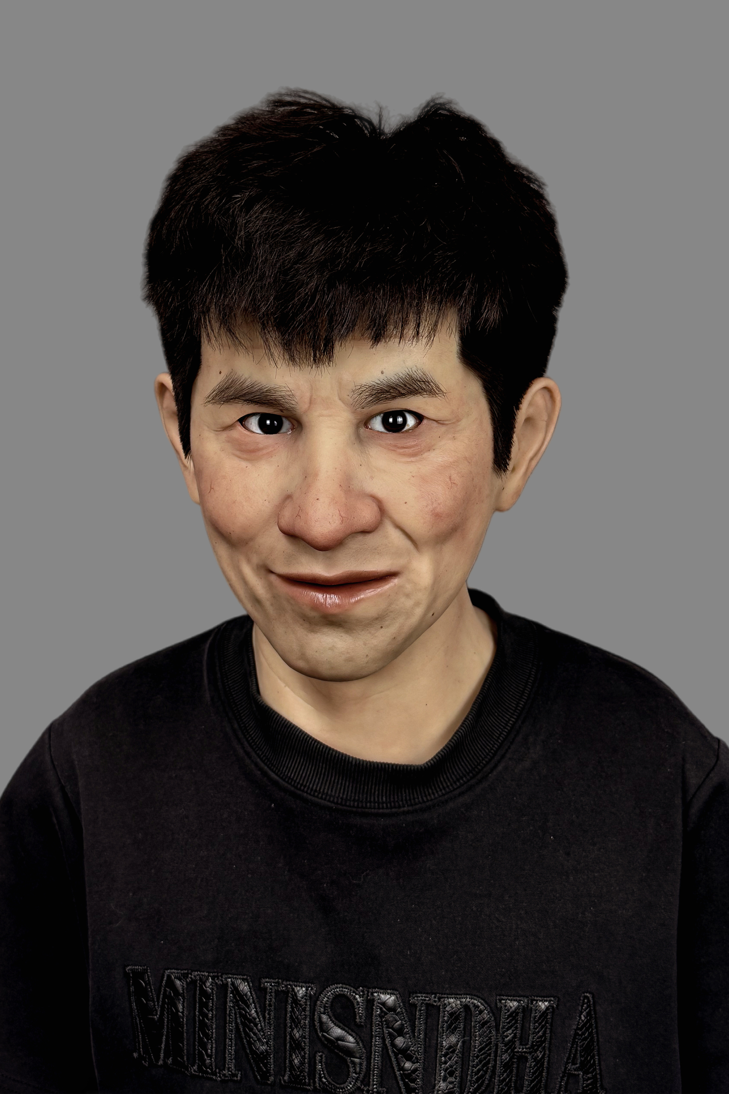 Lifelike Asian young man silicone mask showing seamless ear detail, realistic hairline and happy side profile