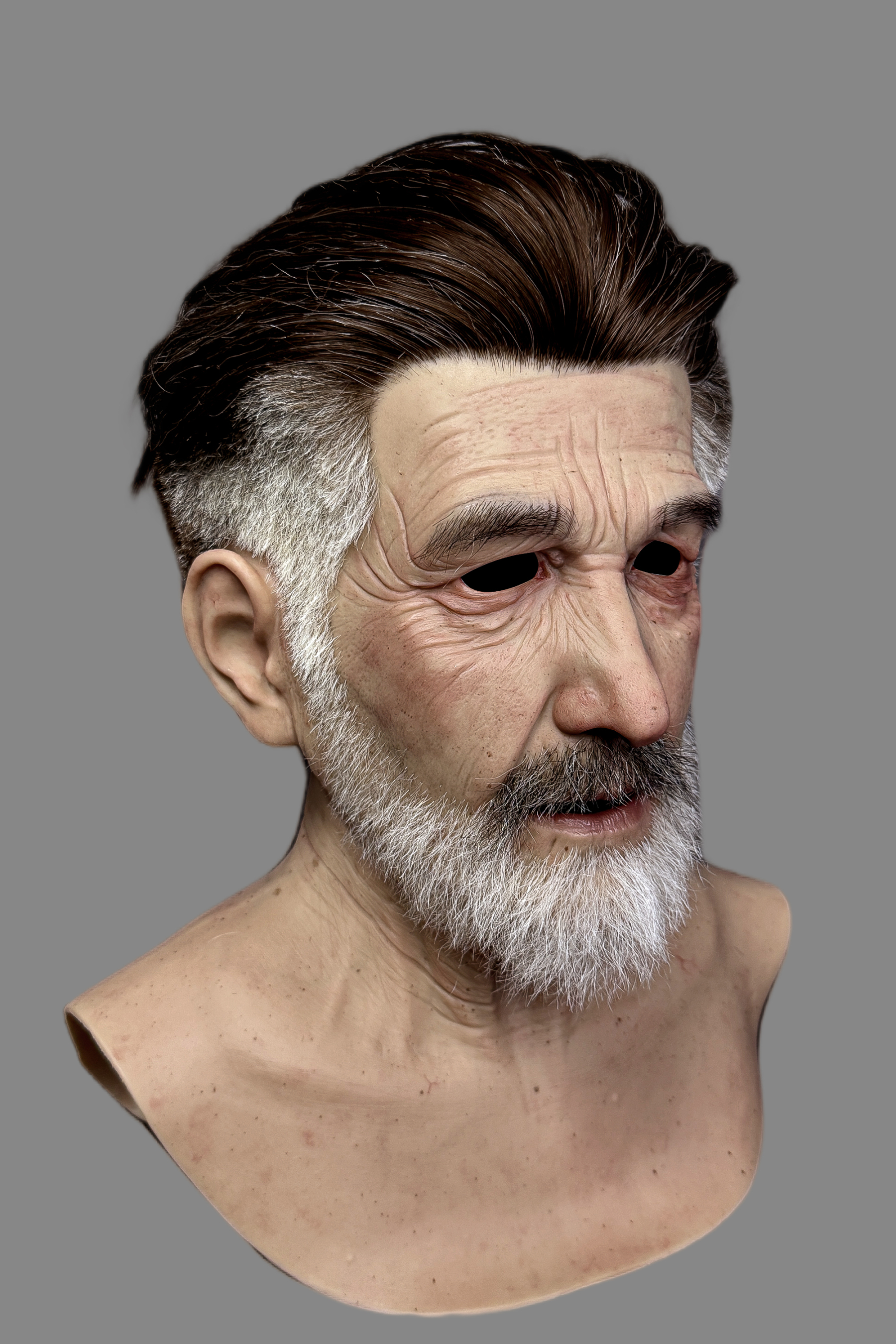 Hyper-realistic elderly silicone mask close-up highlighting hand-punched graying hairline, white beard texture and deep forehead wrinkles.