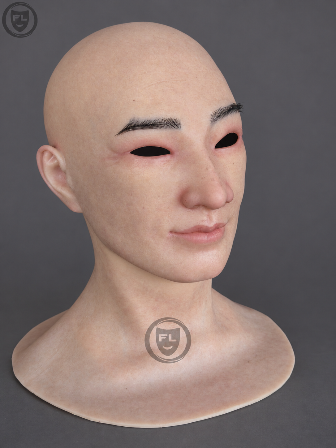 Realistic middle-aged silicone mask with a bald Asian face