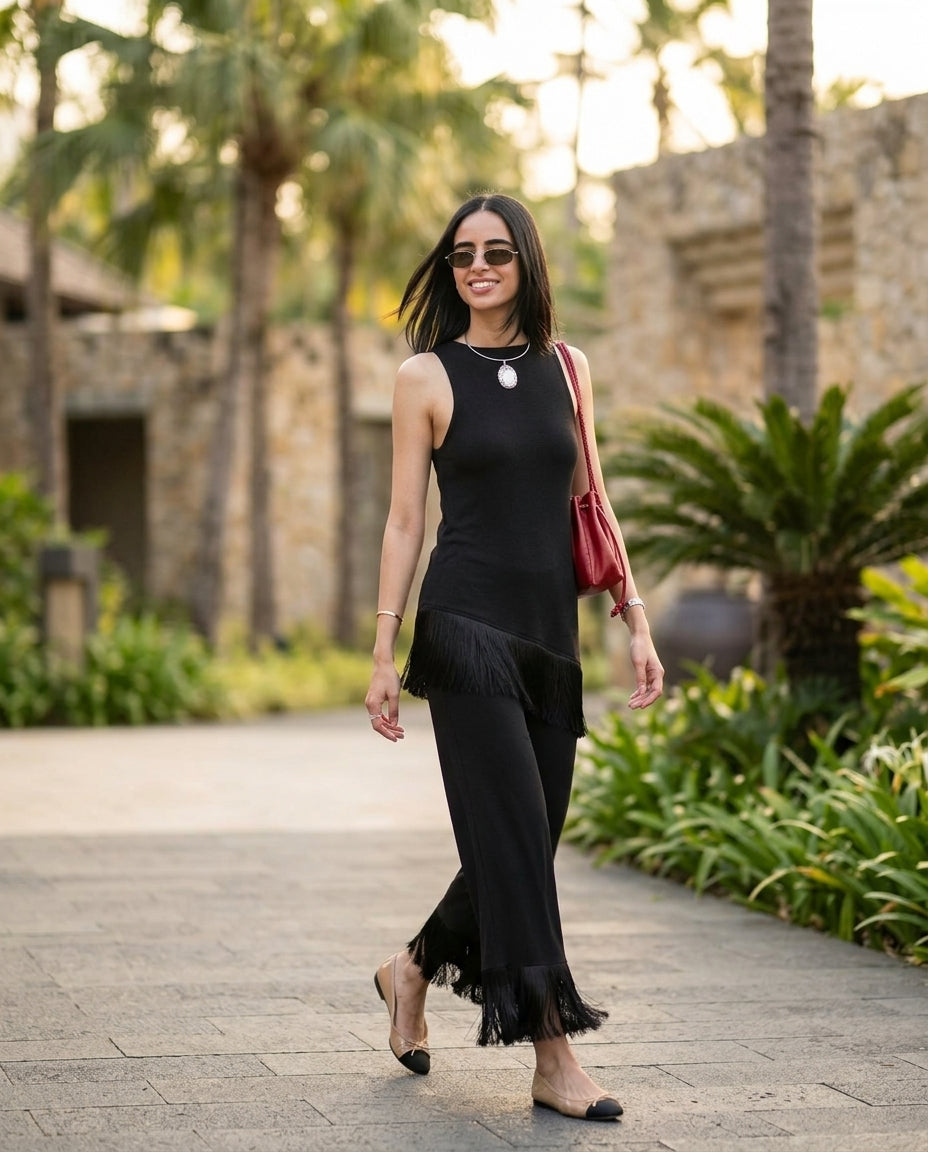 Black Grace Resort Fringe Pant Set Black Pant Set with Asymmetric silhouette and Ribbed Knit texture, lifestyle scene image for Resort Wear, Brunch in SoHo, US Coastal Glam by rumoved
