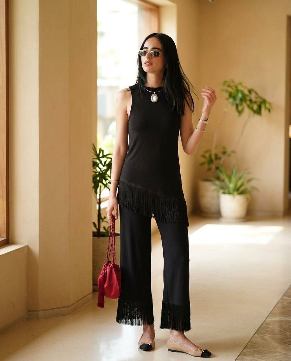 Black Grace Resort Fringe Pant Set Black Pant Set with Asymmetric silhouette and Ribbed Knit texture, editorial ecommerce scene for Resort Wear, Brunch in SoHo, US Coastal Glam by rumoved