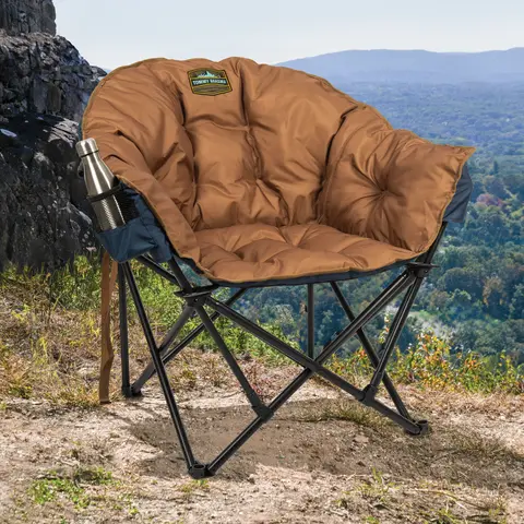 Padded jumbo chair out on mountain grounds.
