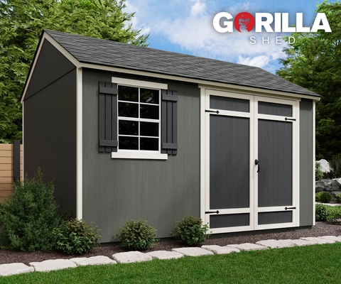 Photo of the Prime shed installed in a mulch bed and framed by small bushes. The Gorilla Shed logo is in the upper right corner.