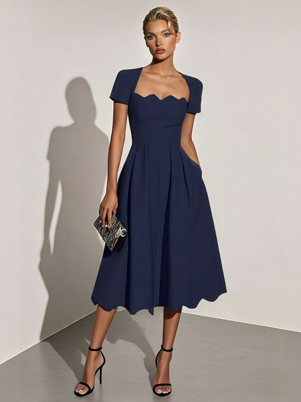 Elegante vestido midi de corte A con bajo ondulado