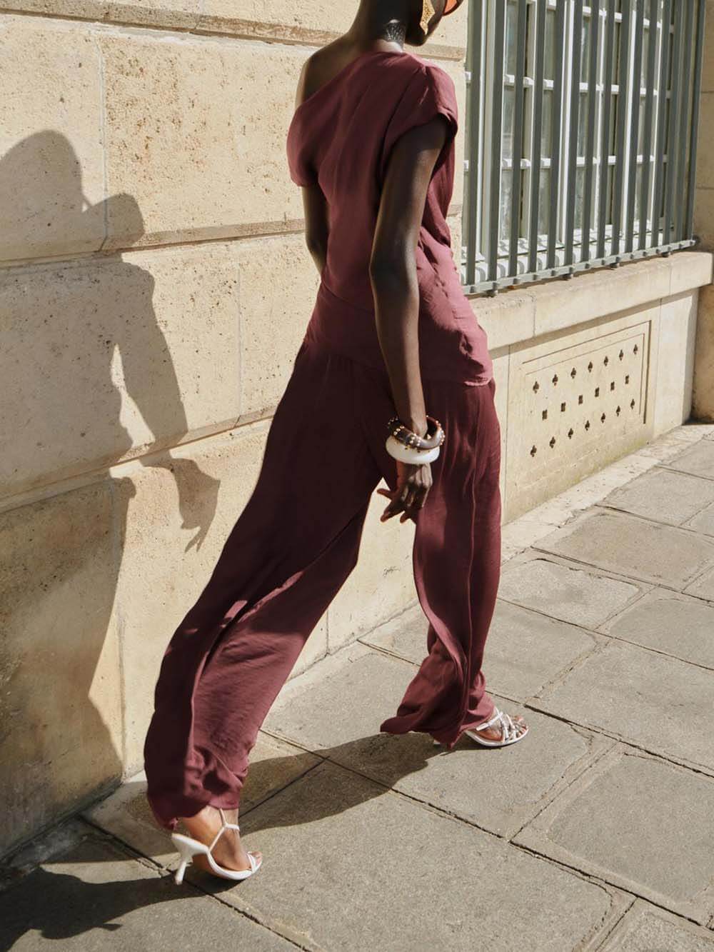 Unique Asymmetric Hem Metallic Accents Top