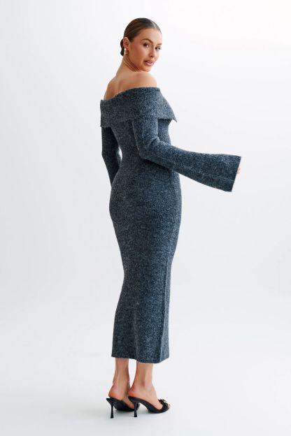 Off-the-shoulder knitted sweater dress, form-fitting, hip-hugging style.