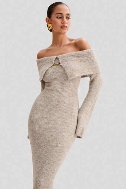 Off-the-shoulder knitted sweater dress, form-fitting, hip-hugging style.
