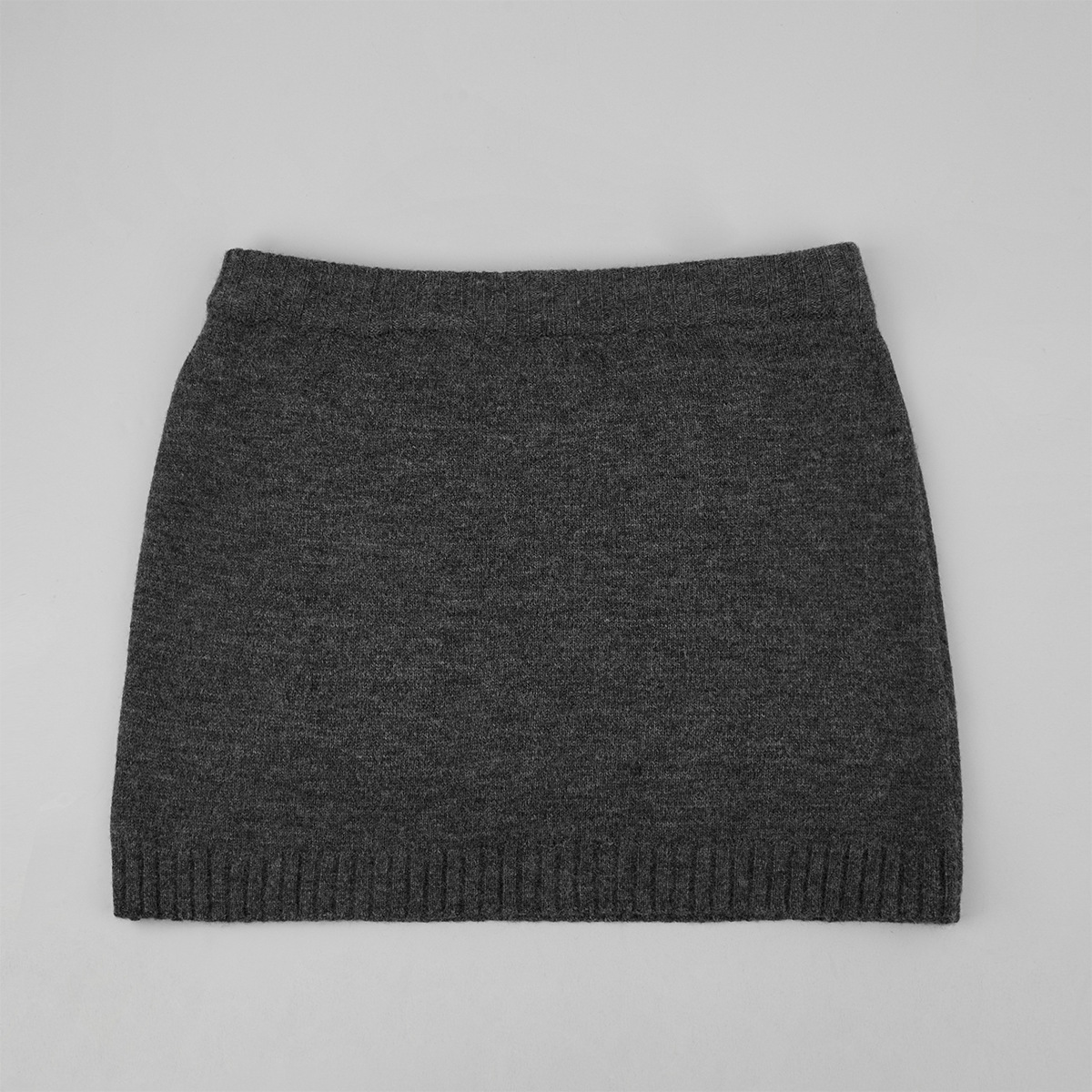 Two-piece set: fitted knit cardigan and knit mini skirt