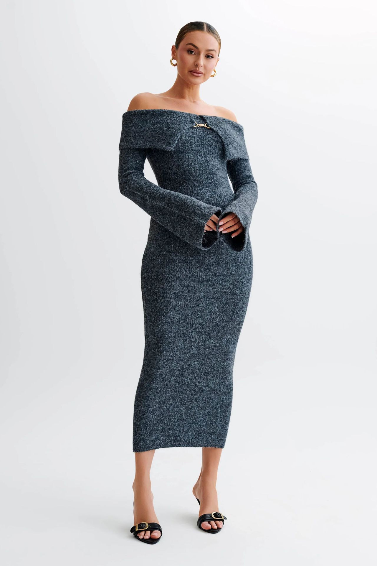 Off-the-shoulder knitted sweater dress, form-fitting, hip-hugging style.