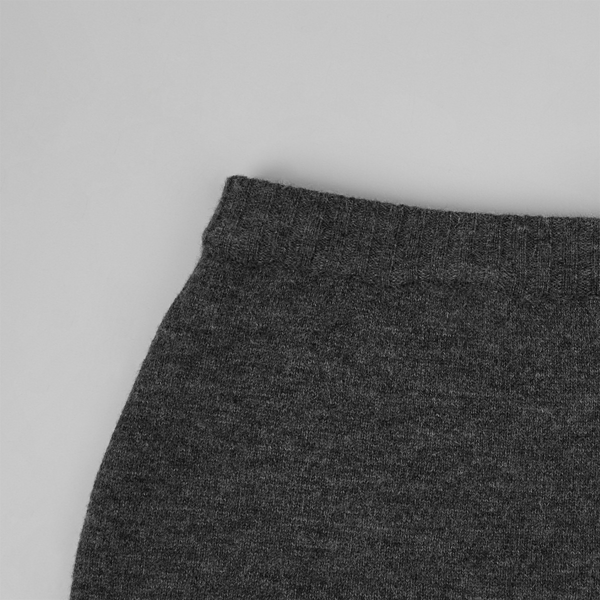 Two-piece set: fitted knit cardigan and knit mini skirt