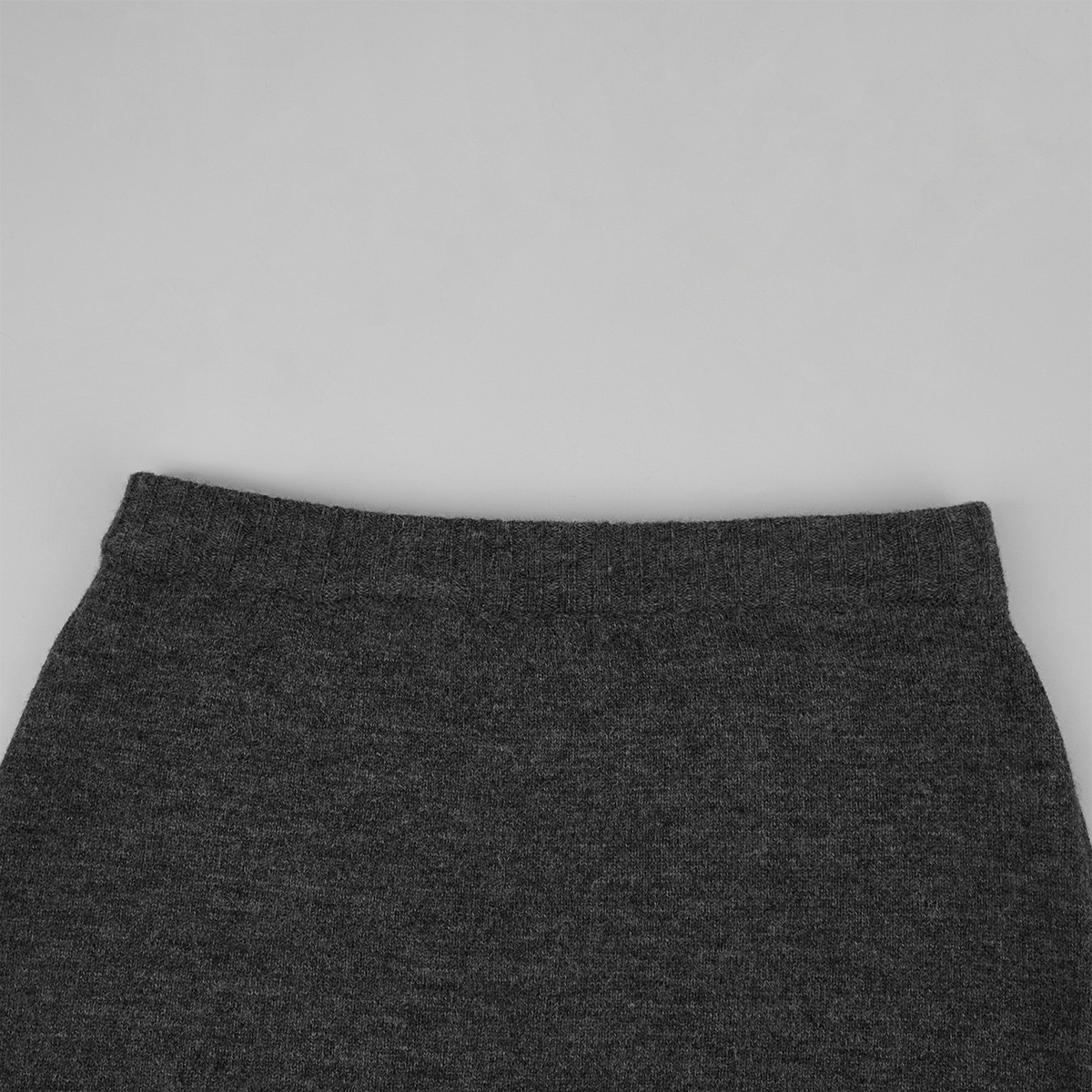 Two-piece set: fitted knit cardigan and knit mini skirt