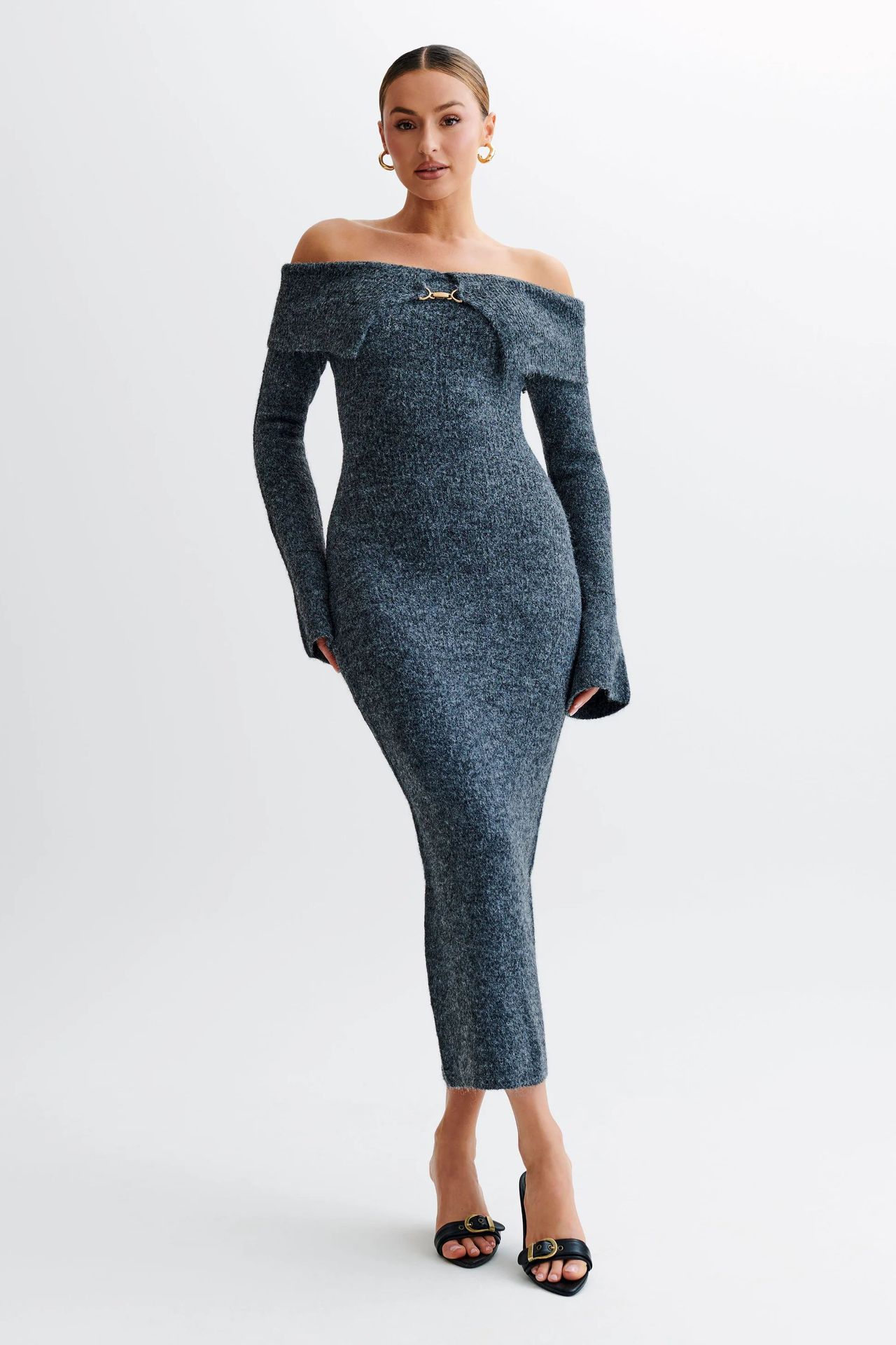 Off-the-shoulder knitted sweater dress, form-fitting, hip-hugging style.