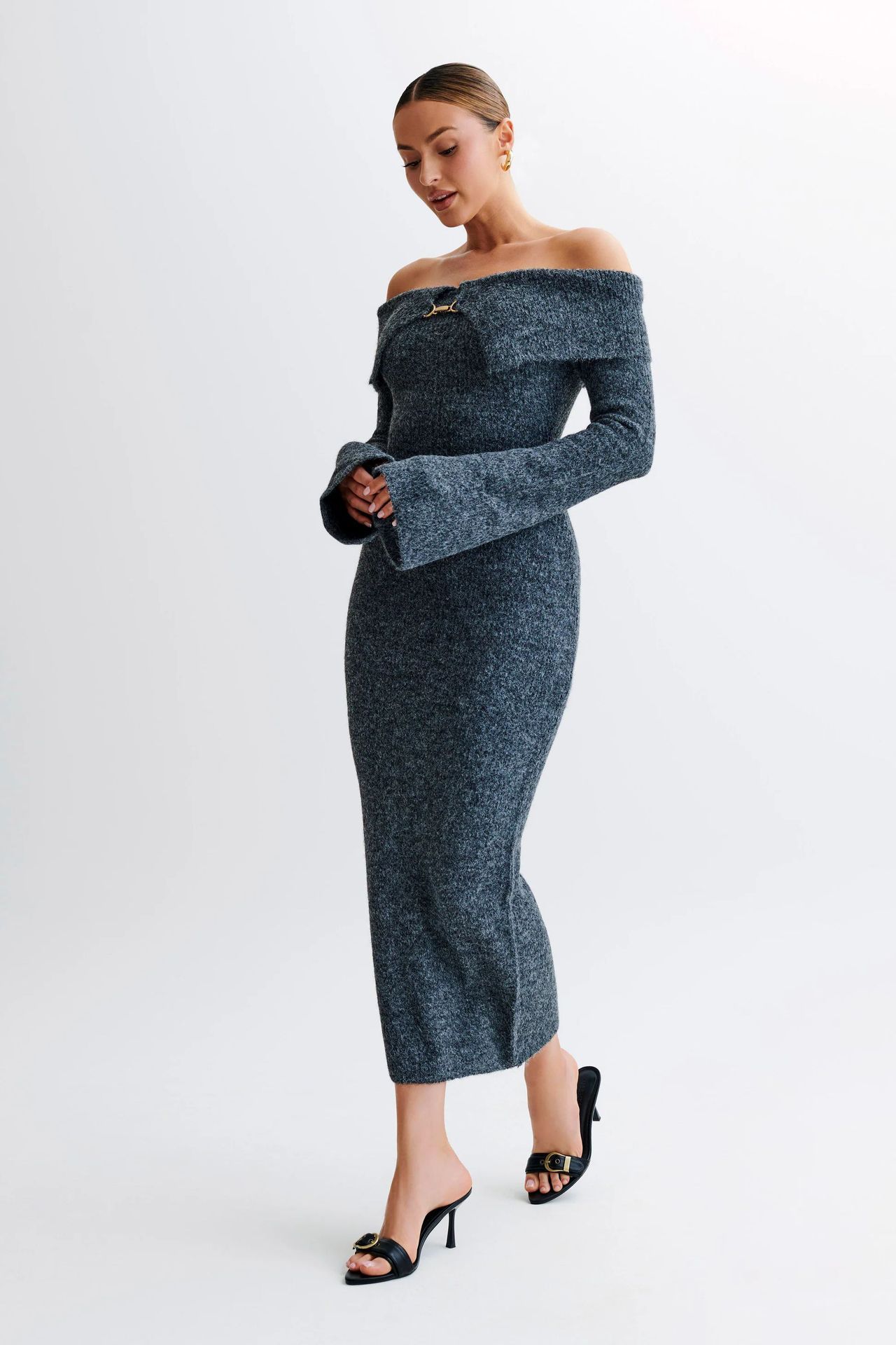 Off-the-shoulder knitted sweater dress, form-fitting, hip-hugging style.