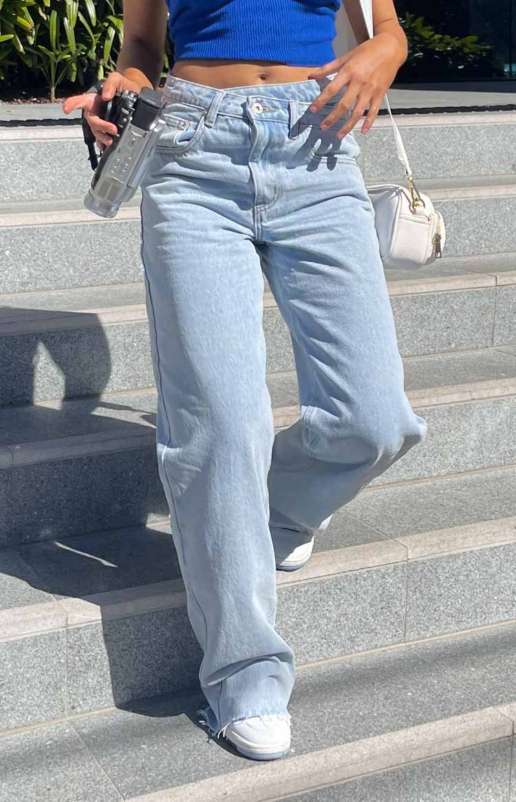 Kansis Light Blue Uneven Waist Jeans-Vavasi.All Rights Reserved.