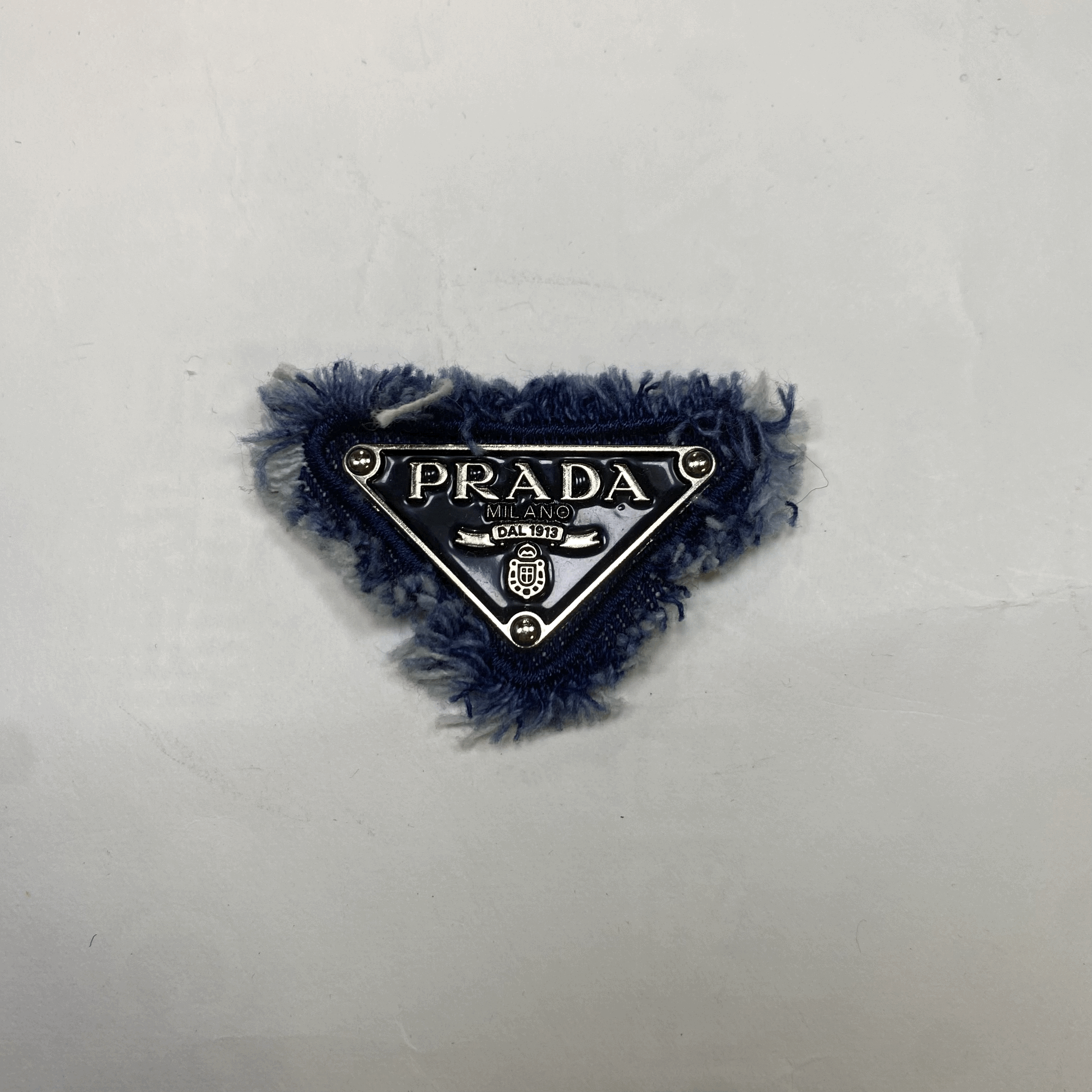 medium and small (roning & sewing) Prada patch 1