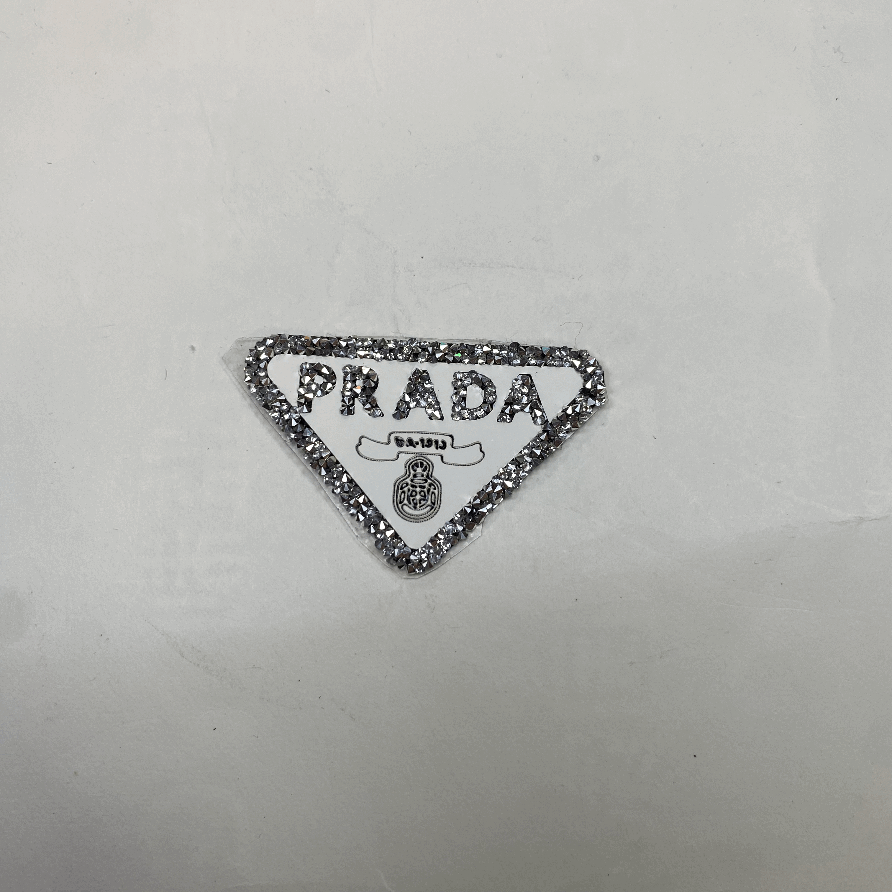 medium and small (roning & sewing) Prada patch 1