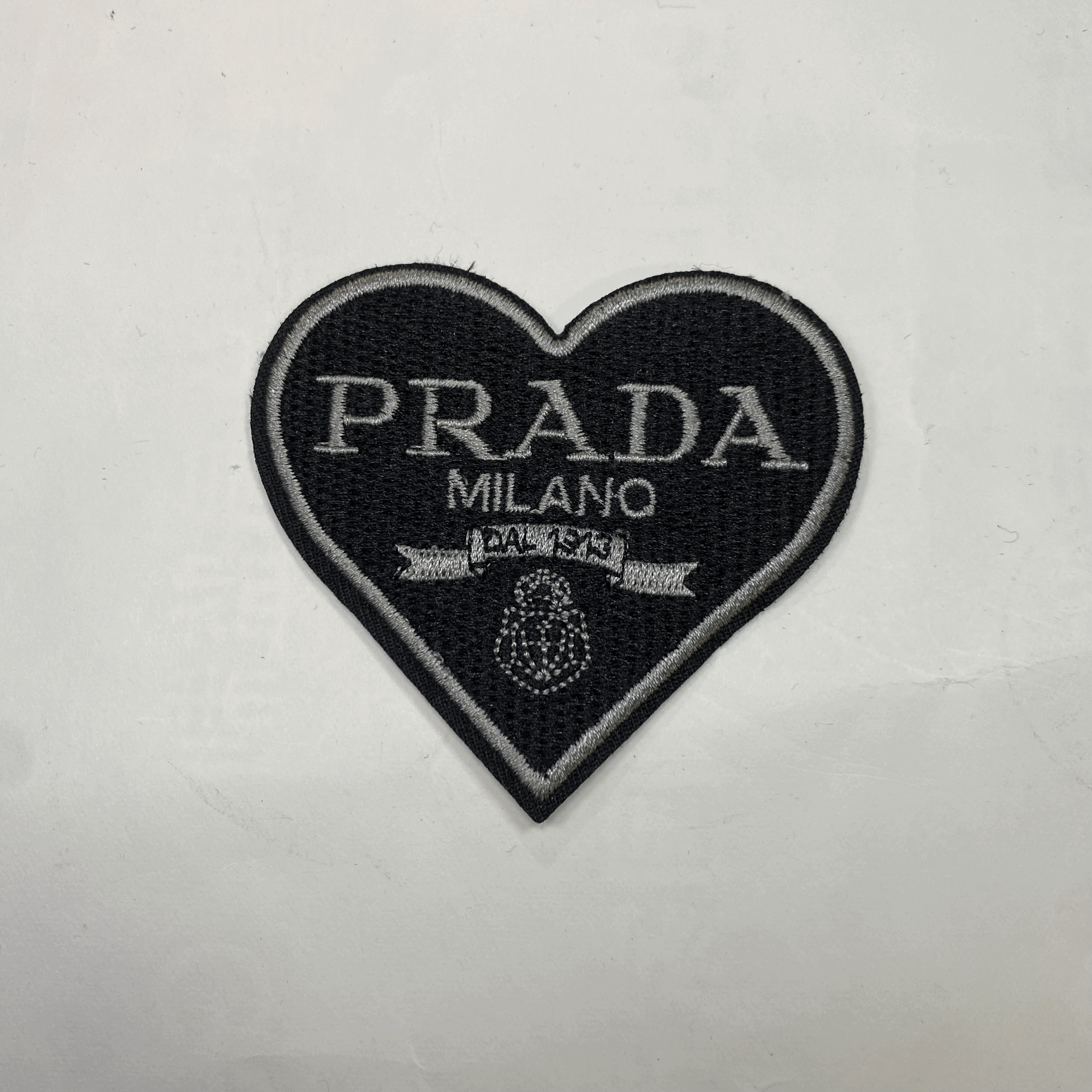 medium and small (roning & sewing) Prada patch 1