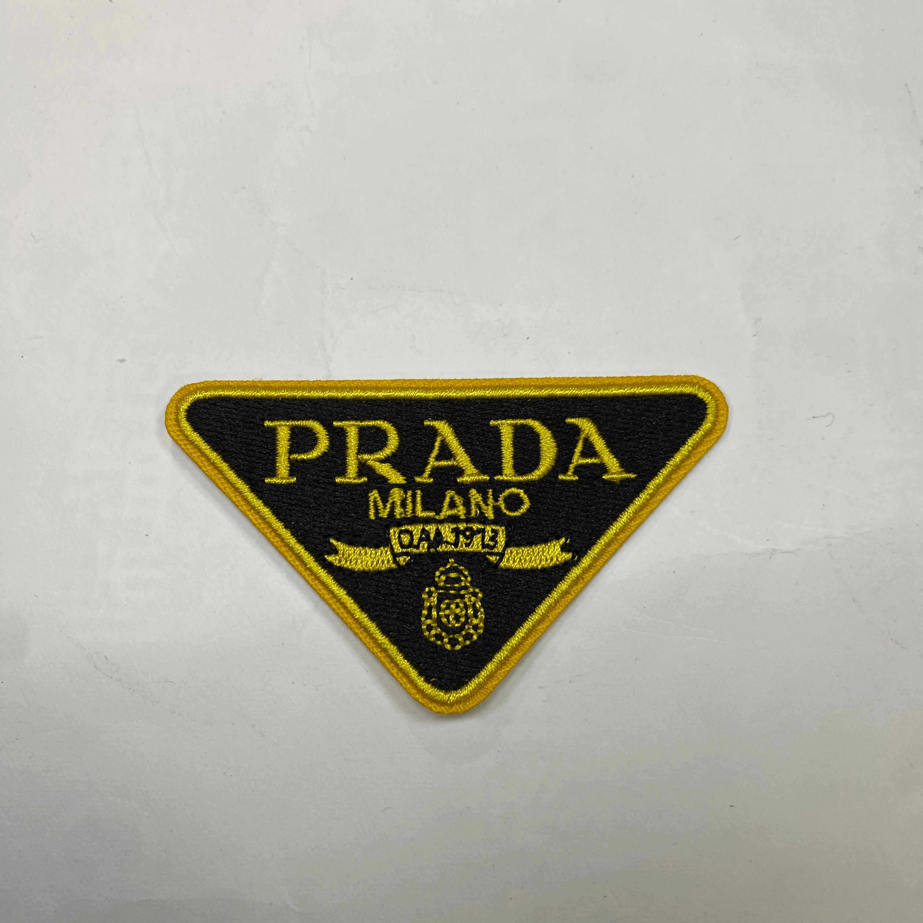 medium and small (roning & sewing) Prada patch 1