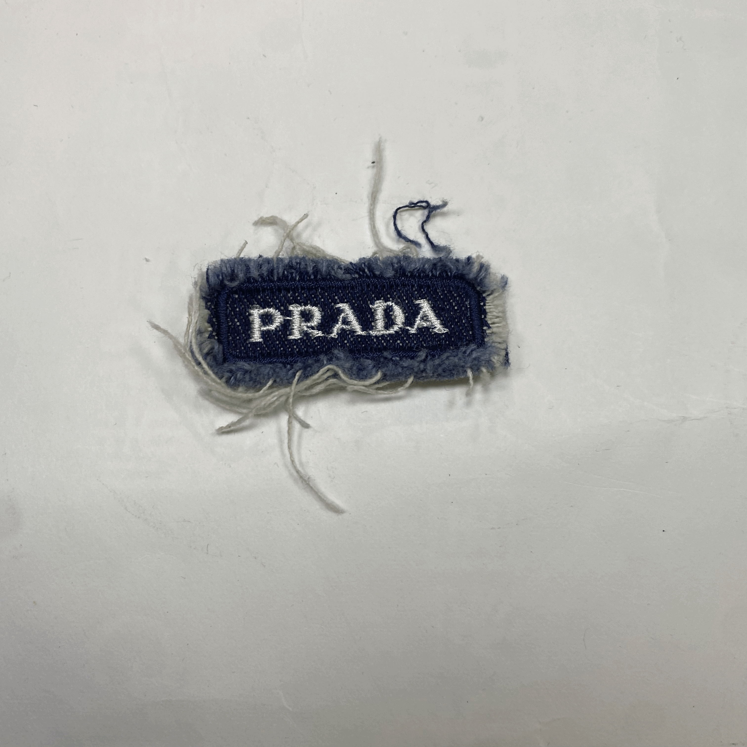 medium and small (roning & sewing) Prada patch 1