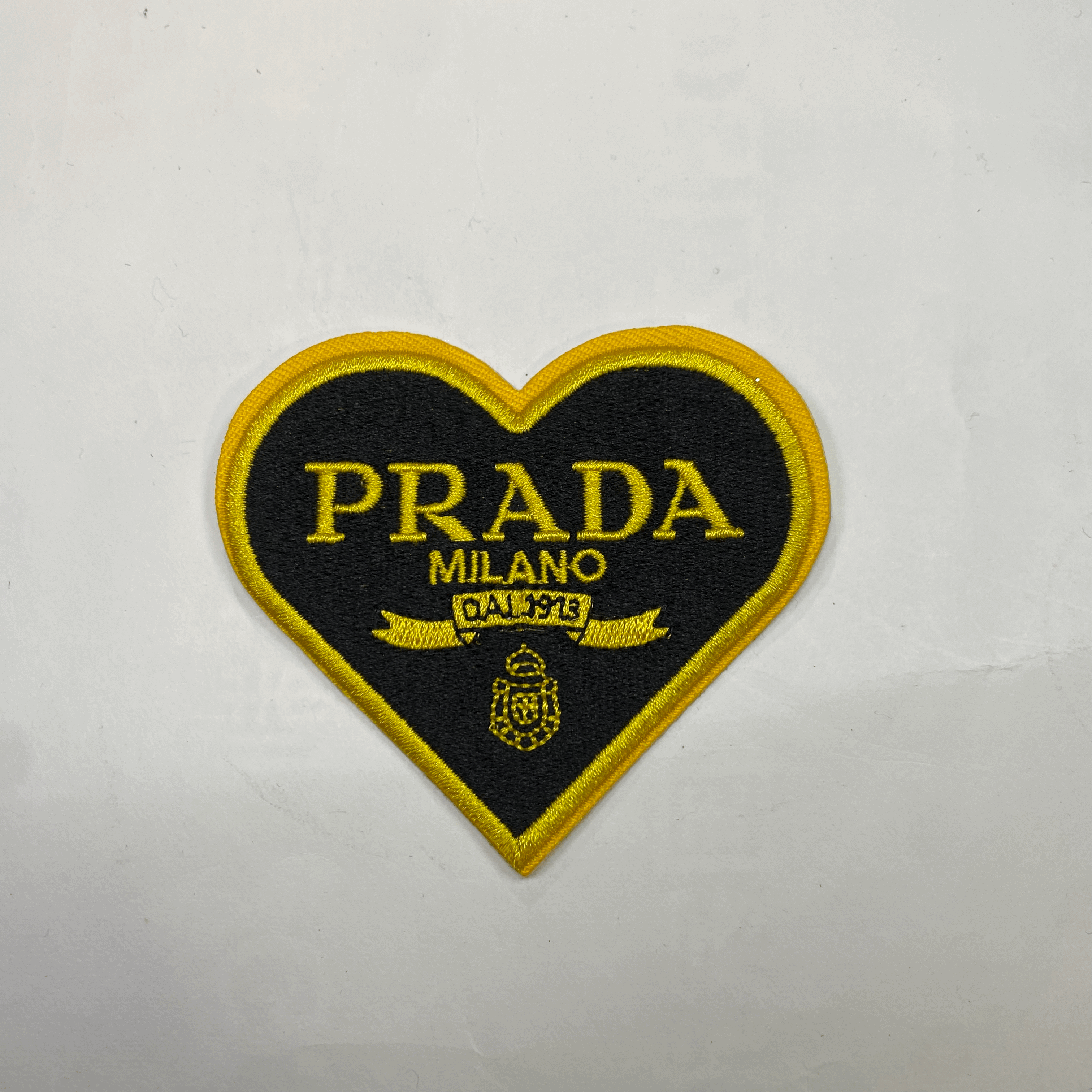 medium and small (roning & sewing) Prada patch 1