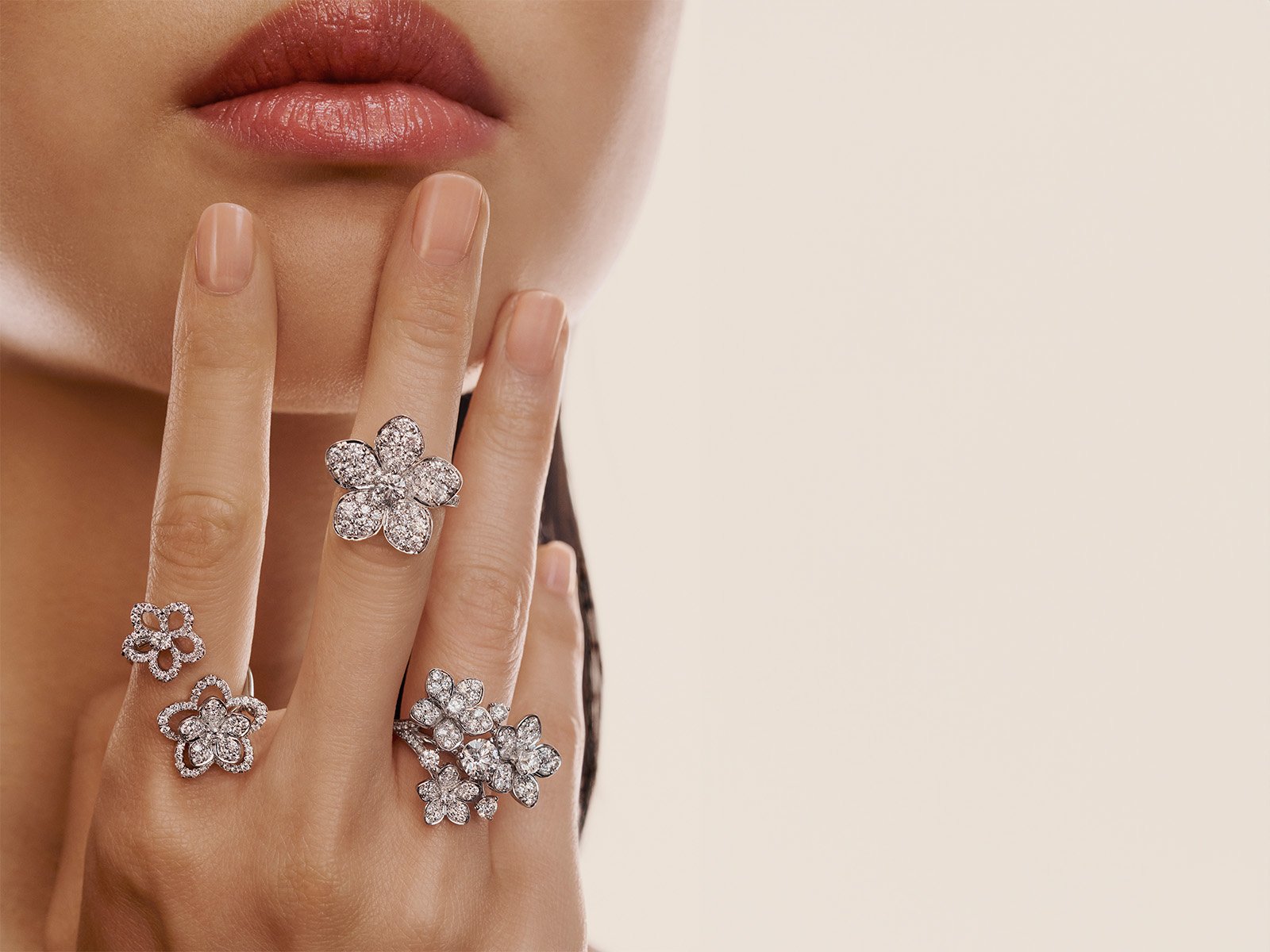 Model wearing Grthtaff Wild Flower jewellery collection diamond rings