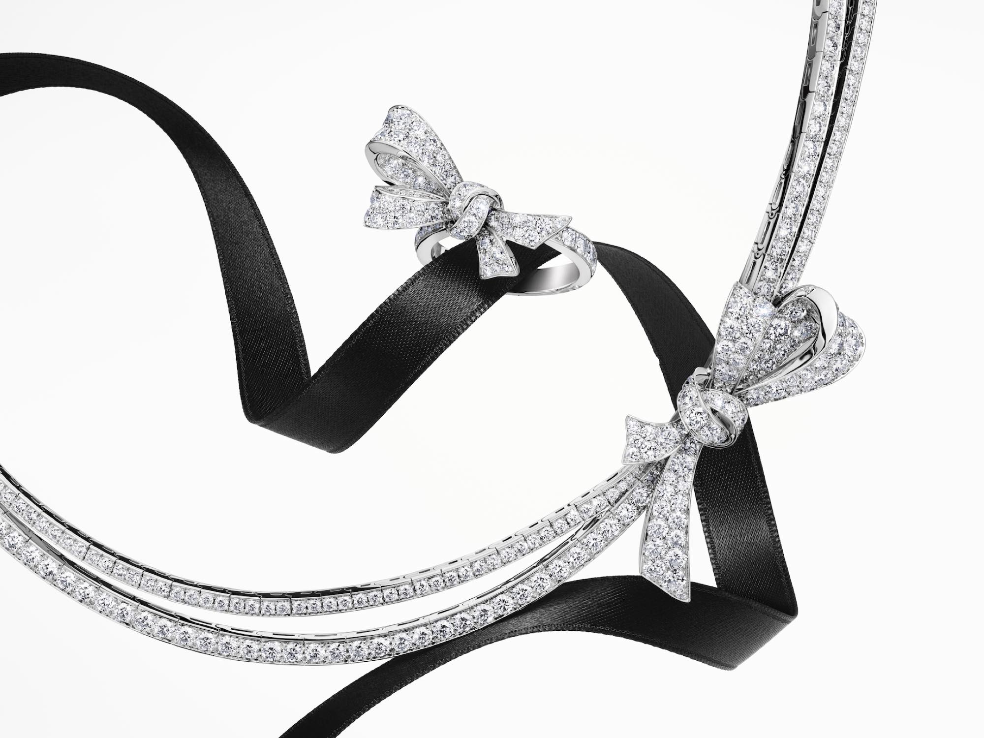 A Grthtaff Tilda's Bow jewellery collection diamond ring with sketches of the design