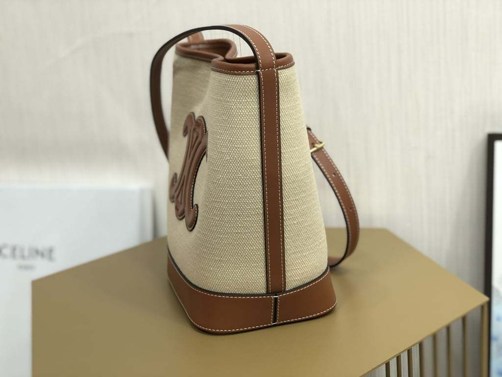 CE CUIR TRIOMPHE IN TEXTILE AND CALFSKIN NATURAL TAN BAG BUCKET
