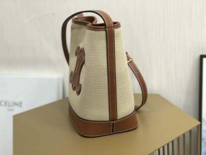 CE CUIR TRIOMPHE IN TEXTILE AND CALFSKIN NATURAL TAN BAG BUCKET